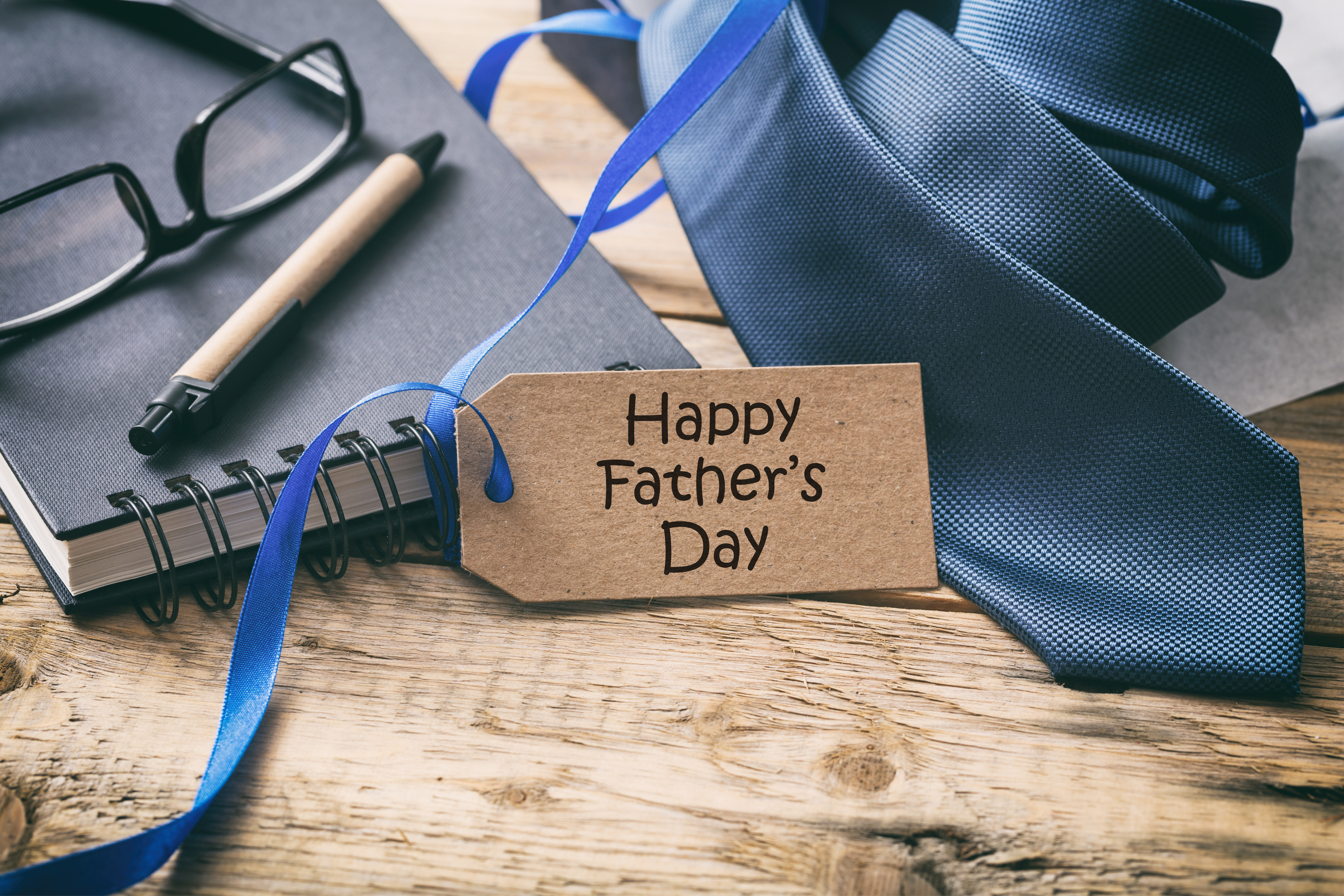 https://www.spectrio.com/wp-content/uploads/2014/06/happy-father-s-day-blue-tie-and-tag-office-desk-2021-08-26-16-34-06-utc.jpg